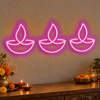 Three Diyas Neon Sign in pink LED neon on clear acrylic, angled view