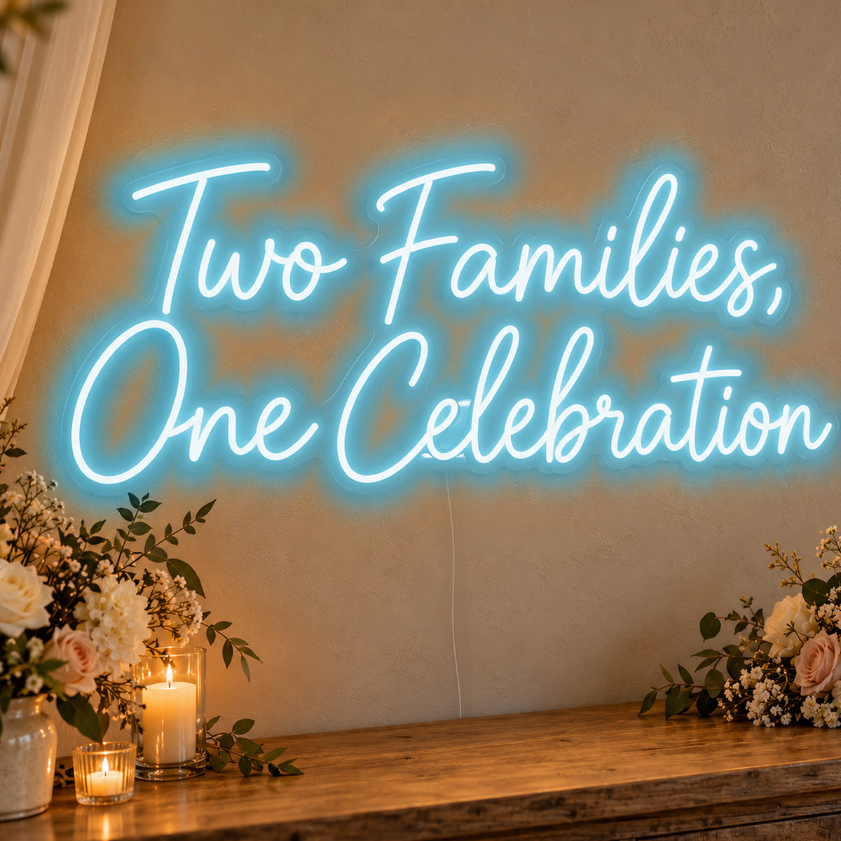 Two Families One Celebration Neon Sign in ice blue LED neon on clear acrylic, angled view