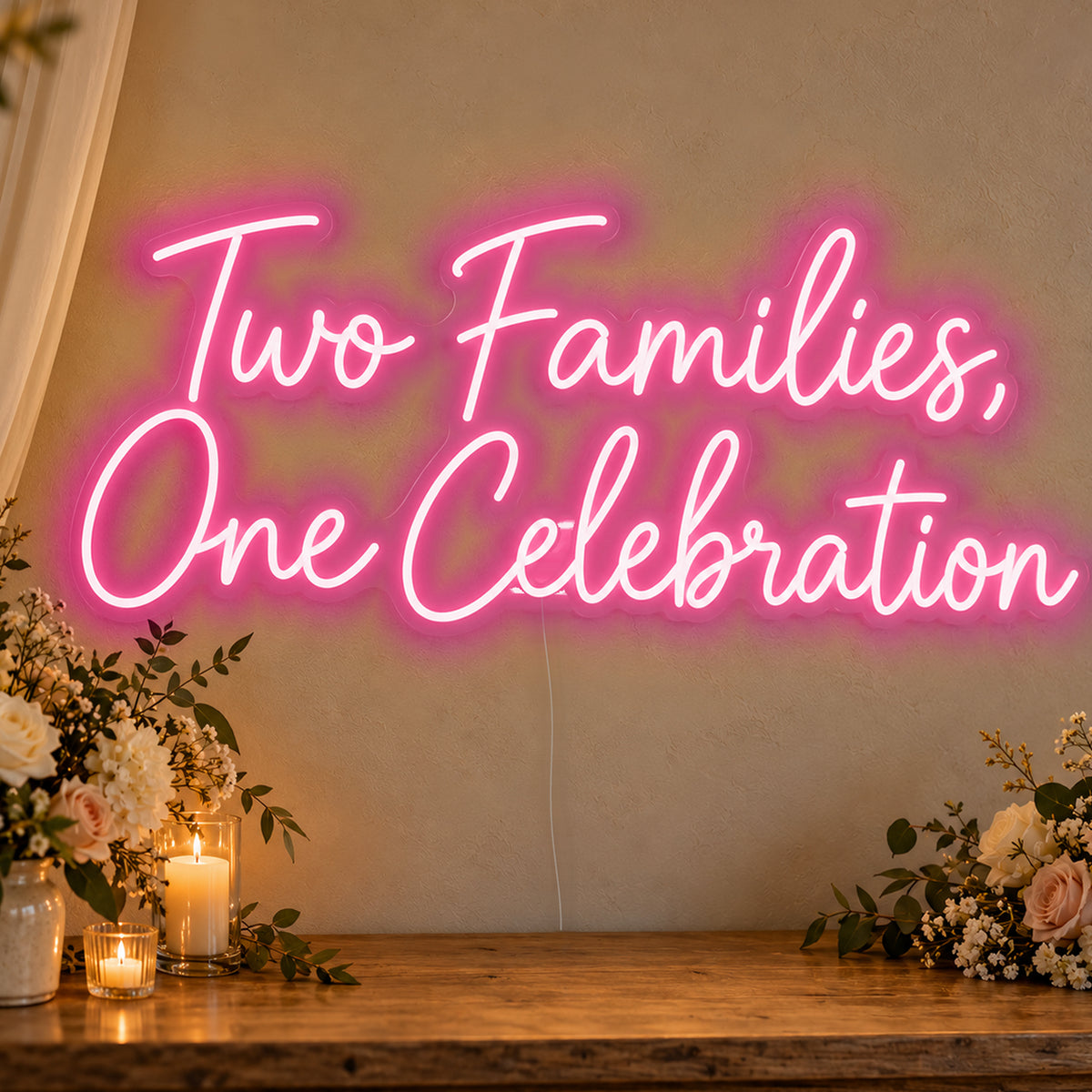 Two Families One Celebration Neon Sign in rose red LED neon on clear acrylic, angled view