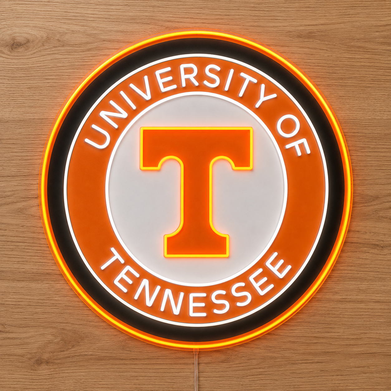 University of Tennessee circle logo LED neon sign lit against timber panelling