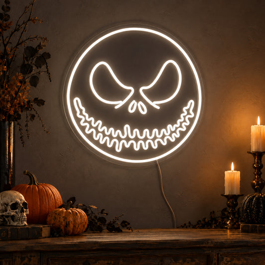 White Jack Skellington Face Neon Sign featuring Jack Skellington's eyes and stitched smile within a white circular face outline, glowing on a dark wall in a Halloween room display.