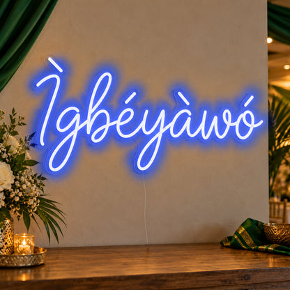 Ìgbéyàwó Yoruba Wedding Neon Sign in blue LED neon on clear acrylic, angled view