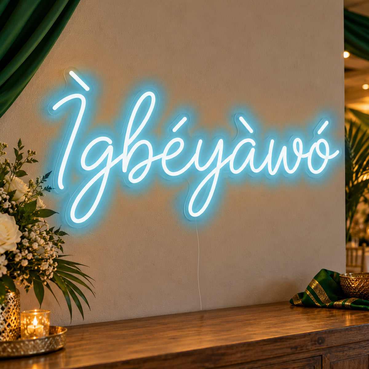 Ìgbéyàwó Yoruba Wedding Neon Sign in ice blue LED neon on clear acrylic, angled view